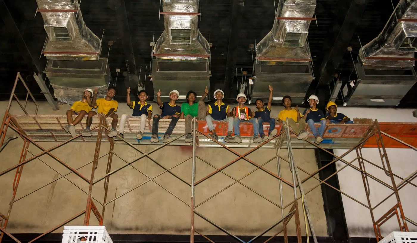Team on a ceiling scaffold